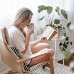 Green Tea Extract - attentive woman drinking beverage while reading book